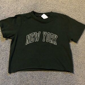 Brandy Melville Dark Green New York Top with Tags. Only one size.